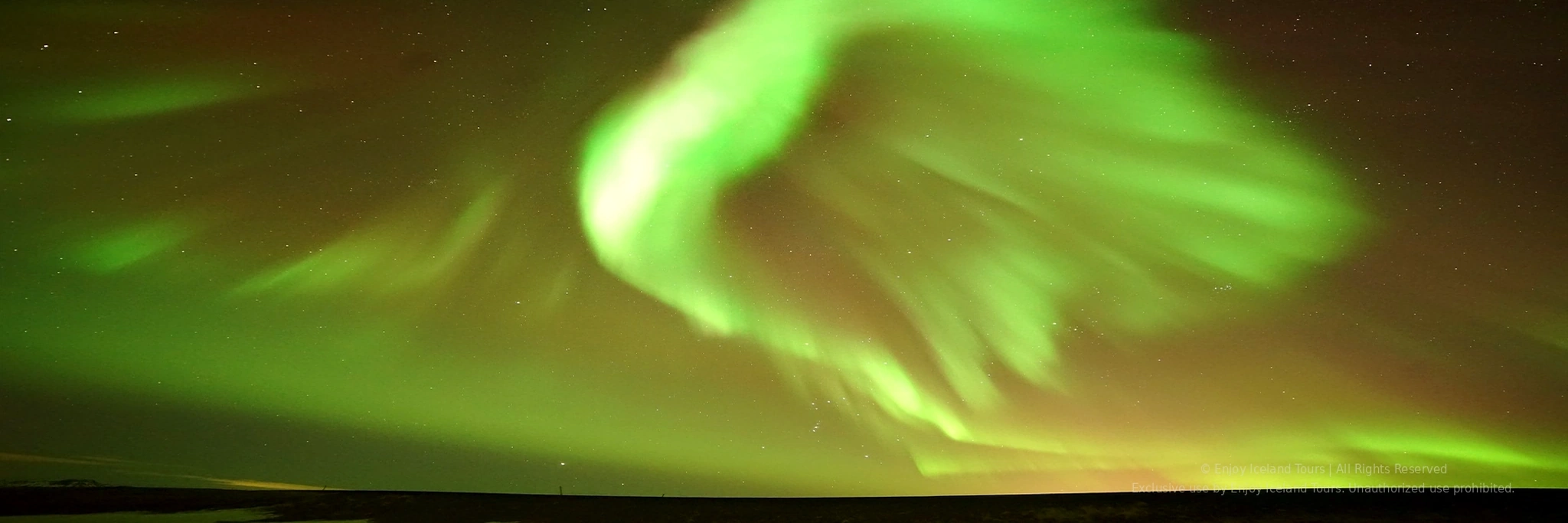 Aurora Borealis glowing over the Icelandic night sky
